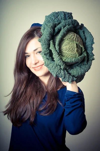 Beautiful woman with savoy cabbage — Stock Photo, Image