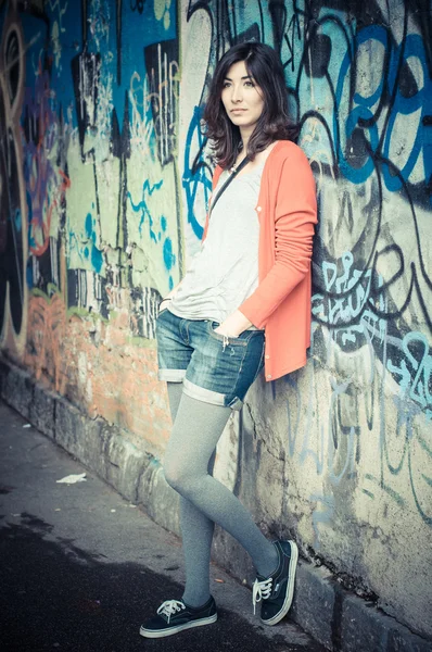 Beautiful stylish woman listening to music — Stock Photo, Image