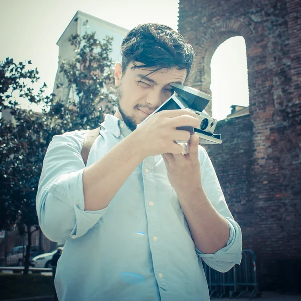 Stylish man in the street with old camera — Stock Photo, Image