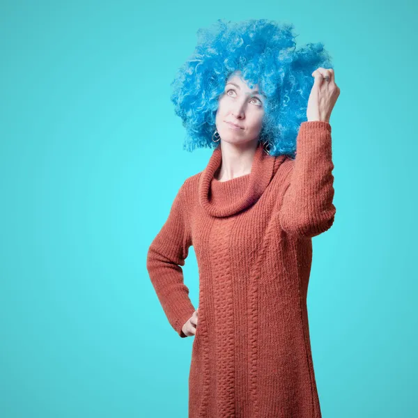 Beautiful girl with curly blue wig and turtleneck — Stock Photo, Image