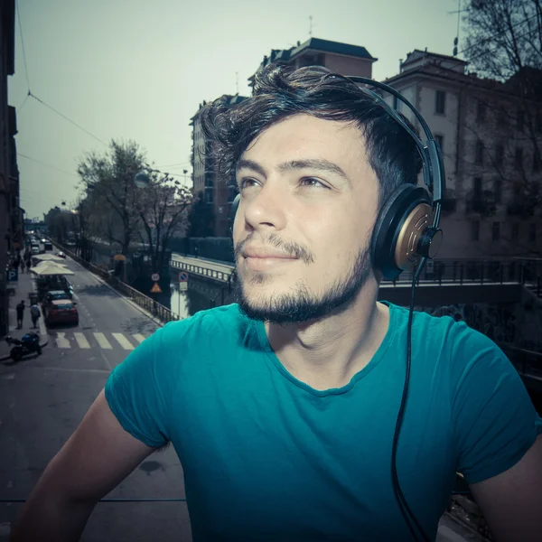 Young man hipster listening to music — Stock Photo, Image