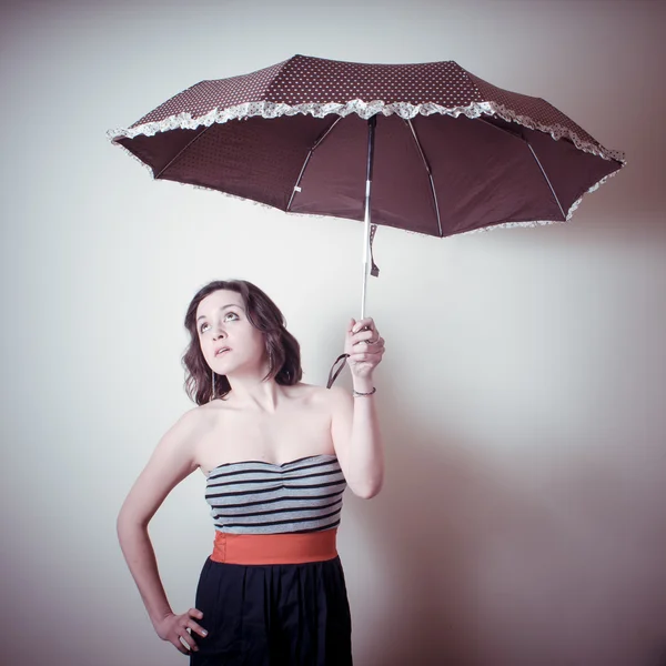 Vintage portrait of young woman with umbrella — Stock Photo, Image