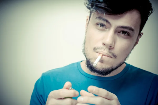 Stylish young modern man with cigarette — Stock Photo, Image