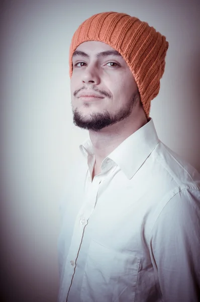 Young modern stylish man with orange cap — Stock Photo, Image