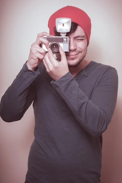 Young stylish man holding old camera — Stock Photo, Image