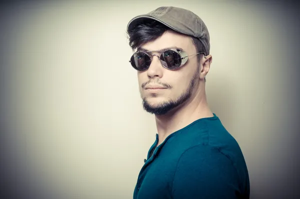 Young modern stylish man with cap — Stock Photo, Image
