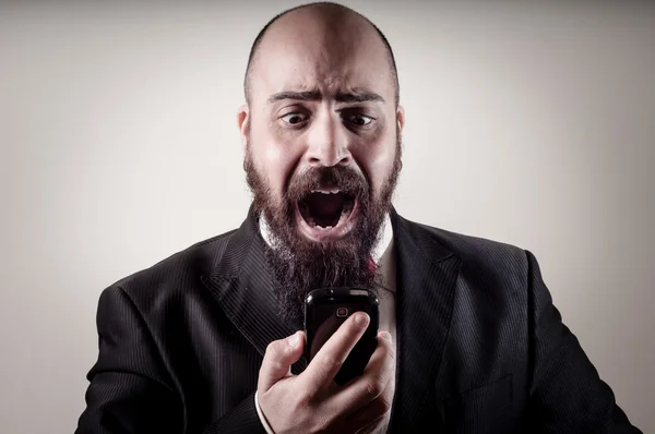 Funny elegant bearded man screaming on the phone — Stock Photo, Image