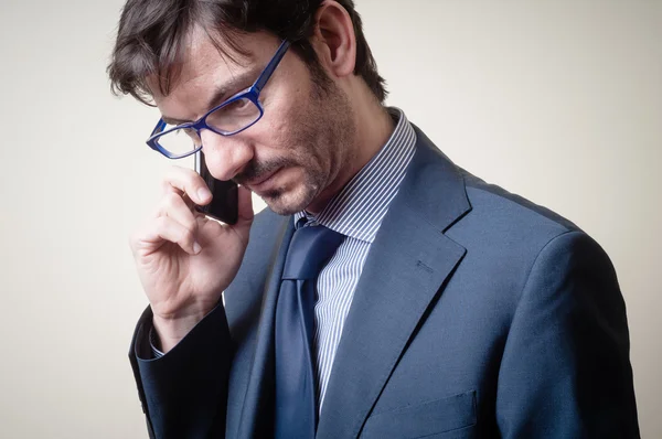 Affärsman i telefon — Stockfoto