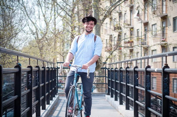 Hipster young man on bike — Stock Photo, Image