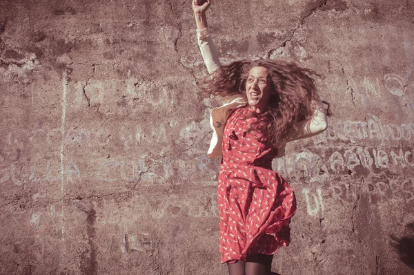 Happy eastern vintage hipster woman jumping — Stock Photo, Image