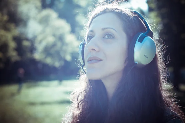 Vintage hipster eastern woman with headphones — Stock Photo, Image