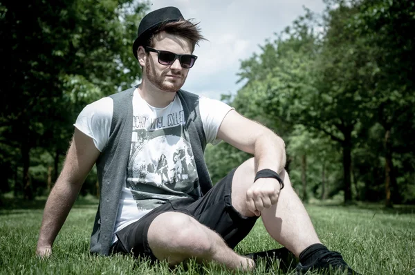 Stylish man in the park — Stock fotografie