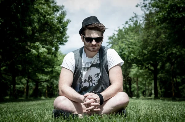 Stylish man in the park — Stock fotografie