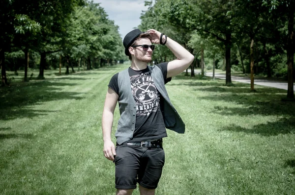 Stylish man in the park — Stock fotografie