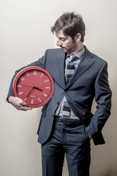 Businessman with clock — Stock Photo, Image