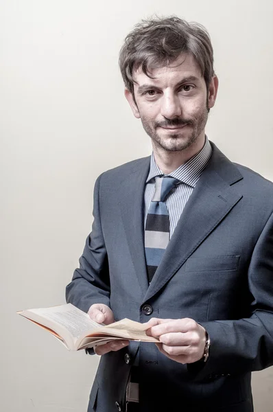 Businessman reading book — Stock Photo, Image