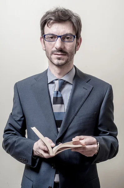 Businessman reading book — Stock Photo, Image