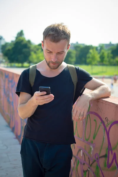 Hipster modern stylish blonde man with phone — Stock Photo, Image