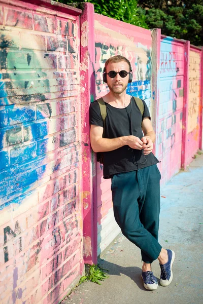 Hipster modern stylish blonde man listening music — Stock Photo, Image