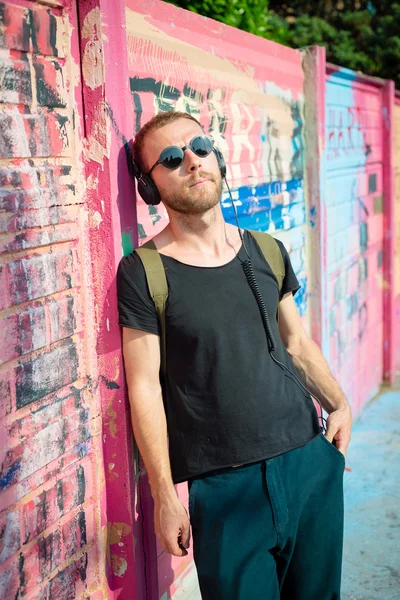 Hipster modern stylish blonde man listening music — Stock Photo, Image