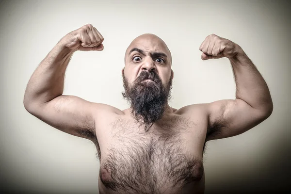 Super power angry muscle bearded man Stock Picture