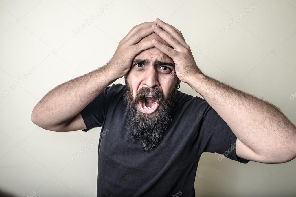 Desperate bearded man isolated