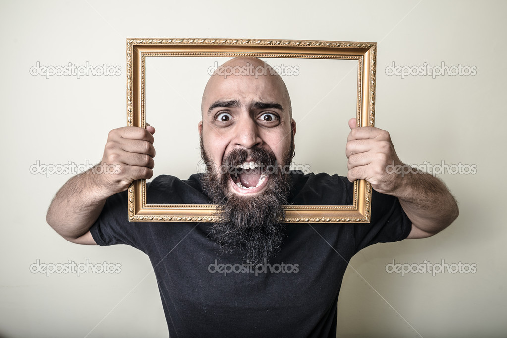 Funny bearded man with golden frame