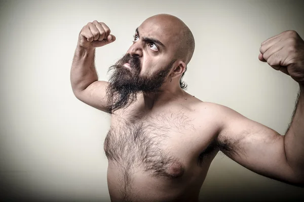 Super power angry muscle bearded man Royalty Free Stock Images