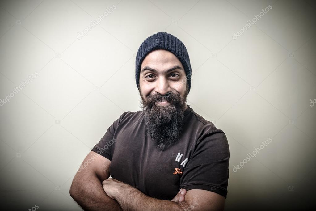 Smiling bearded man with cap