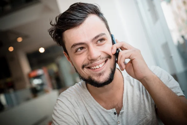 Young stylish man with phone — Stock Photo, Image