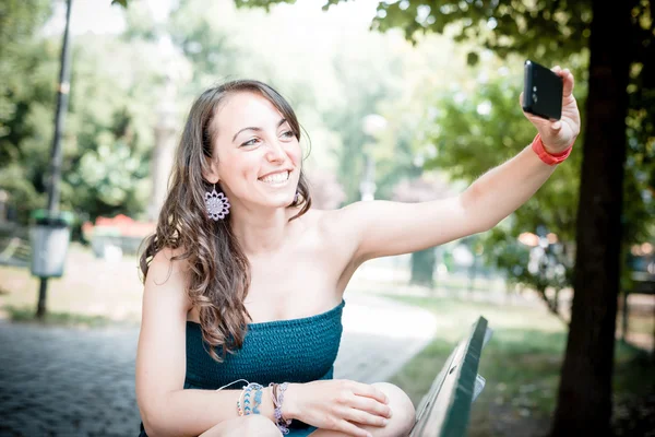 Beautiful woman taking self-portrait — Stock Photo, Image