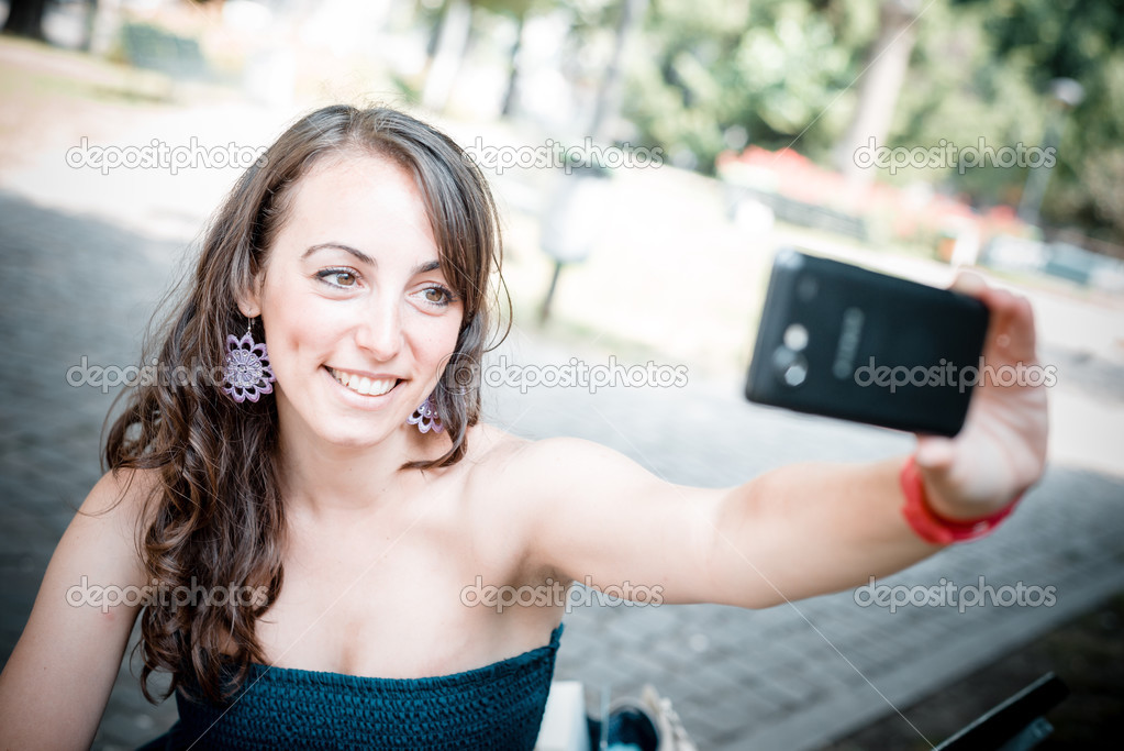 beautiful woman taking self-portrait