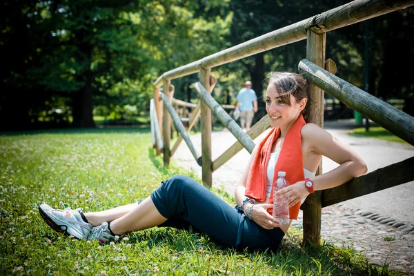 Beautiful woman fitness relaxing after sport — Stock Photo, Image