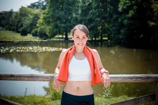 Beautiful woman fitness relaxing after sport — Stock Photo, Image