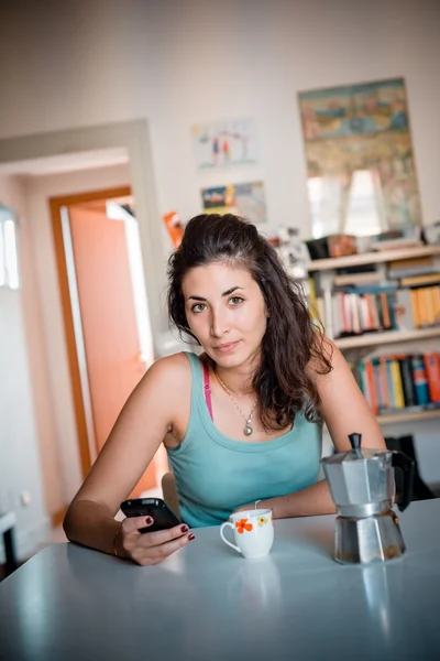 Beautiful woman calling during breakfast — Stock Photo, Image