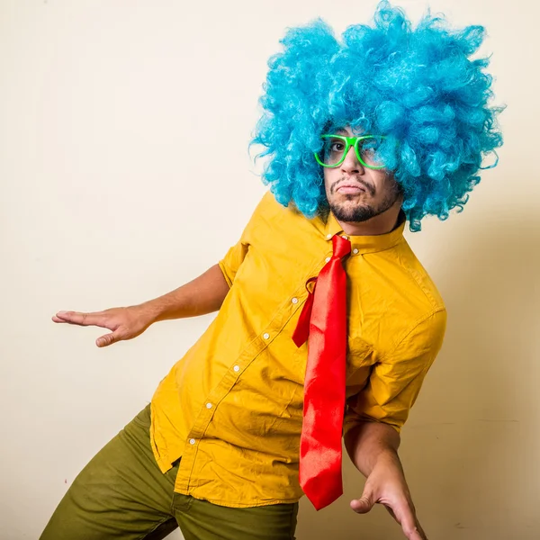 Crazy funny young man with blue wig — Stock Photo, Image