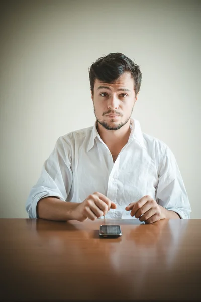 Young stylish man with white shirt on the phone — Stock Photo, Image