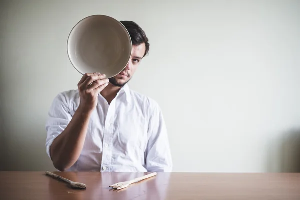 Young stylish man with white shirt and dish in his face — Stock Photo, Image