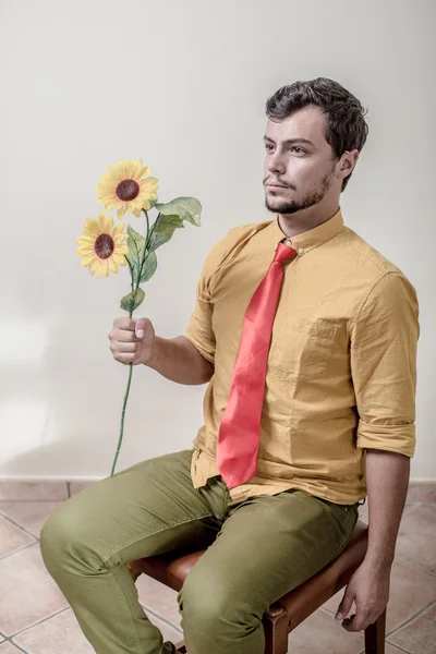 Young stylish man with flowers — Stock Photo, Image