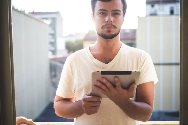 Yuong stylish hipster man using tablet — Stock Photo, Image