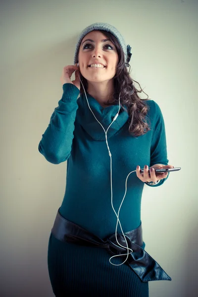 Beautiful woman with turtleneck walking in the city — Stock Photo, Image