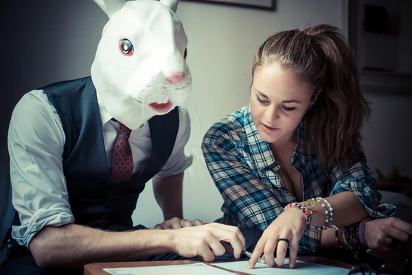 Rabbit mask man and woman working — Stock Photo, Image