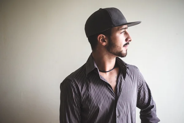 Young stylish man with sport hat — Stock Photo, Image