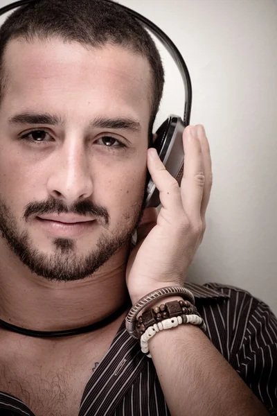 Young stylish man listening to music — Stock Fotó