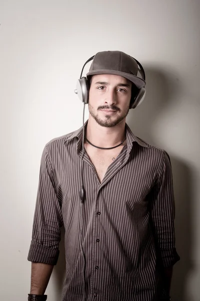 Young stylish man listening to music — Stock Fotó