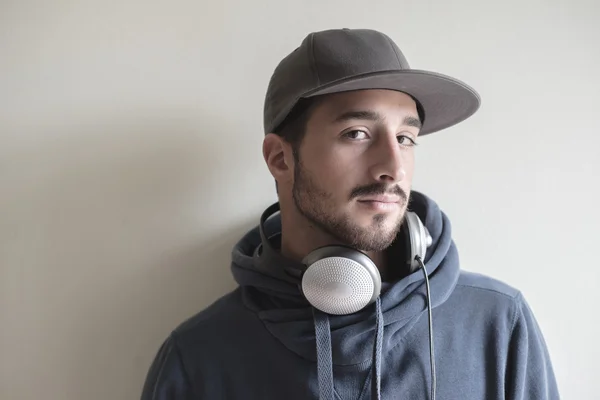 Young stylish man listening to music — Stock Fotó