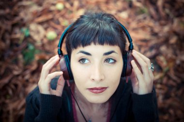 beautiful young woman listening to music clipart