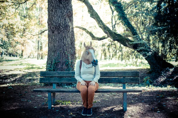 Young hipster horse mask woman in autumn — Stock Photo, Image
