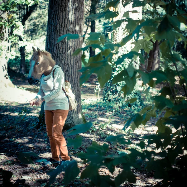 Young hipster horse mask woman in autumn — Stock Photo, Image