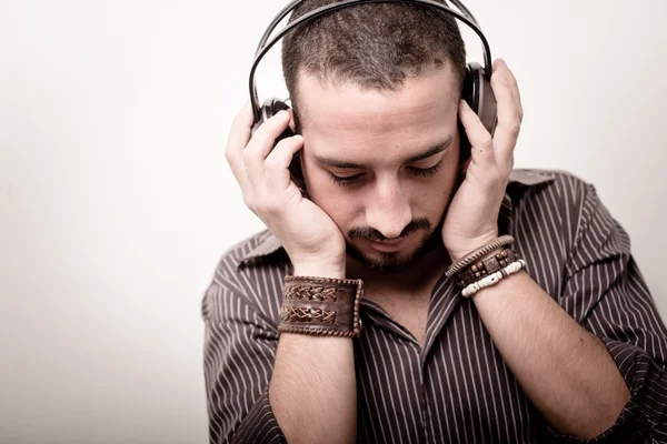 Young stylish man listening to music Royalty Free Stock Photos